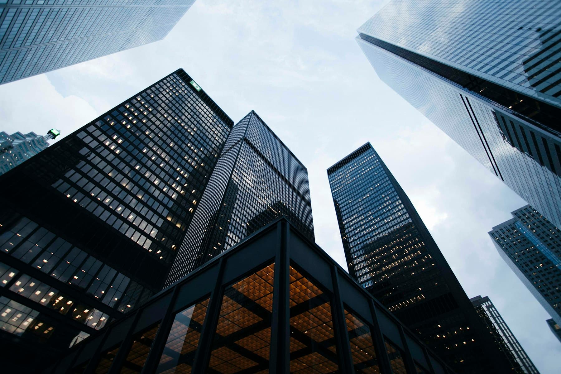 Modern corporate headquarters with a rhythmic glass and stone facade
